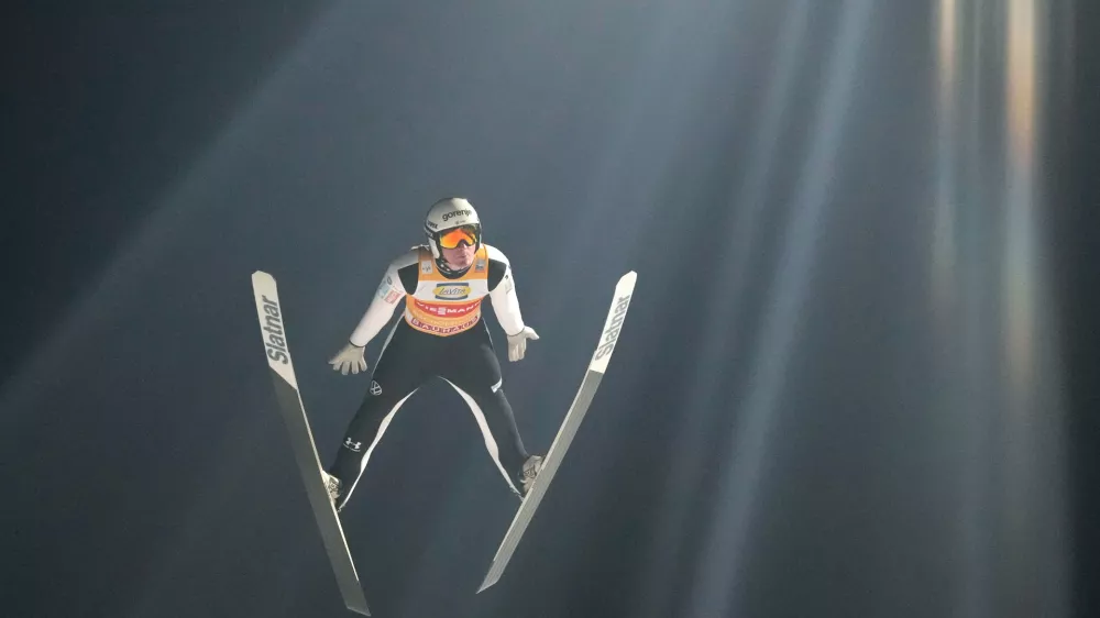 Domen Prevc, of Slovenia, soars through the air during his first round jump at the fourth stage of the Four Hills ski jumping tournament in Bischofshofen, Austria, Tuesday, Jan. 6, 2026. (AP Photo/Matthias Schrader)