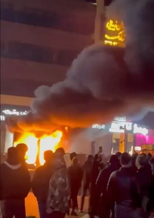In this frame grab from video taken by an individual not employed by The Associated Press and obtained by the AP outside Iran shows a fire as people protest in Tehran, Iran, Friday, Jan. 9, 2026. (UGC via AP)