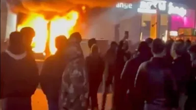In this frame grab from video taken by an individual not employed by The Associated Press and obtained by the AP outside Iran shows a fire as people protest in Tehran, Iran, Friday, Jan. 9, 2026. (UGC via AP)