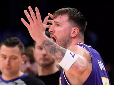 Los Angeles Lakers guard Luka Doncic reacts after being called for a foul during the second half of an NBA basketball game against the Milwaukee Bucks, Friday, Jan. 9, 2026, in Los Angeles. (AP Photo/Mark J. Terrill)