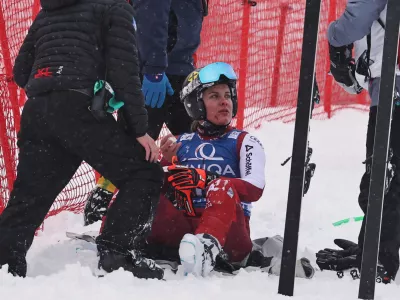 Austria's Magdalena Egger gets medical assistance after crashing during an alpine ski, women's World Cup downhill, in Zauchensee, Austria, Saturday, Jan. 10, 2026. (AP Photo/Marco Trovati)
