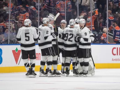 Los Angeles Kings players celebrate the win over the Edmonton Oilers during a shoot-out of an NHL hockey game in Edmonton on Saturday, Jan. 10, 2026. (Jason Franson/The Canadian Press via AP)