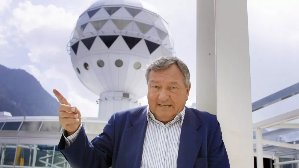 FILE - Erich von Daeniken, co-founder and co-owner of Mystery Park, poses in front of the Panorama Tower at Mystery Park in Interlaken, Wednesday, April 23, 2003. (Gaetan Ball)/Keystone via AP, File)