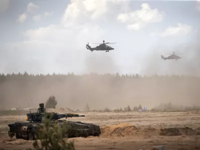 FILE - Eurocopters Tiger of the German Army take part in the Lithuanian-German division-level international military exercise 'Grand Quadriga 2024' at a training range in Pabrade, north of the capital Vilnius, Lithuania on May 29, 2024. (AP Photo/Mindaugas Kulbis, File)