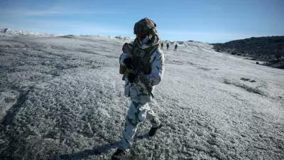 FILE PHOTO: A member of the French armed forces walks on ice during a military drill as Danish, Swedish and Norwegian home guard units together with Danish, German and French troops take part in joint military drills in Kangerlussuaq, Greenland, September 17, 2025. REUTERS/Guglielmo Mangiapane/File Photo