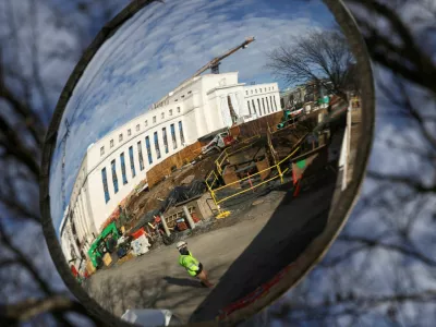 A mirror reflects the construction site of the Federal Reserve headquarters, after U.S. President Donald Trump renewed his threat to bring a lawsuit against&nbsp;Federal Reserve Chair Jerome Powell over Powell's management of renovations of the building, in Washington, D.C., U.S., January 12, 2026. REUTERS/Kevin Lamarque   TPX IMAGES OF THE DAY