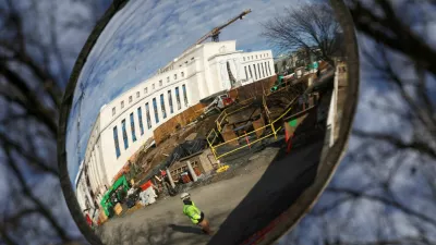 A mirror reflects the construction site of the Federal Reserve headquarters, after U.S. President Donald Trump renewed his threat to bring a lawsuit against&nbsp;Federal Reserve Chair Jerome Powell over Powell's management of renovations of the building, in Washington, D.C., U.S., January 12, 2026. REUTERS/Kevin Lamarque   TPX IMAGES OF THE DAY