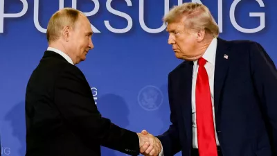 FILE PHOTO: U.S. President Donald Trump and Russian President Vladimir Putin shake hands during a press conference following their meeting to negotiate an end to the war in Ukraine, at Joint Base Elmendorf-Richardson, in Anchorage, Alaska, U.S., August 15, 2025. REUTERS/Kevin Lamarque/File Photo