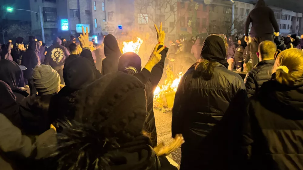 In this photo obtained by The Associated Press, Iranians attend an anti-government protest in Tehran, Iran, Friday, Jan. 9, 2026. (UGC via AP)