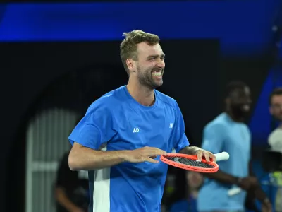 14 January 2026, Australia, Melbourne: Jordan Smith of Australia reacts after winning a point against Jannik Sinner of Italy during the 1 Point Slam event during the Australian Open Opening Week at Rod Laver Arena in Melbourne. Photo: James Ross/AAP/dpa