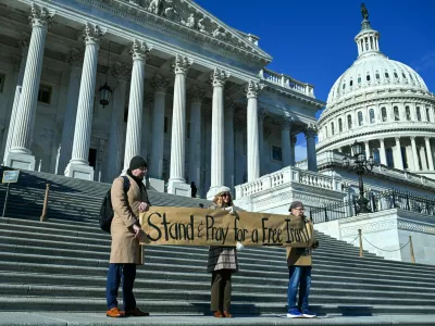 Demonstrators pray and rally in support of nationwide protests in Iran, on Capitol Hill in Washington, D.C., U.S., January 15, 2026. REUTERS/Annabelle Gordon