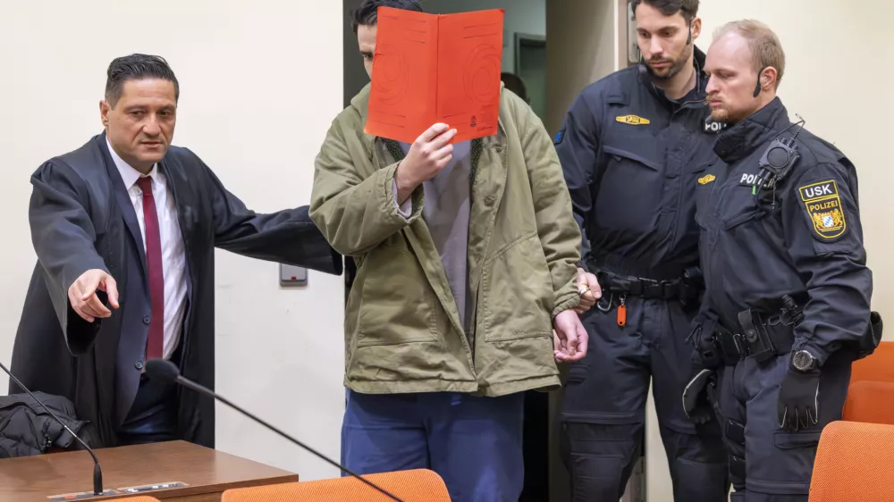 16 January 2026, Bavaria, Munich: The defendant Farhad N. arrives in the courtroom at the start of his trial on charges of double murder following a car attack on a demonstration in Munich on February 13, 2025. Photo: Peter Kneffel/dpa