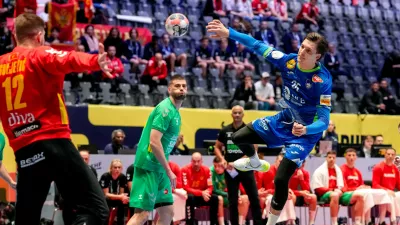 Slovenia's Domen Makuc in action during the European Championship handball match between Slovenia and Montenegro in B&aelig;rum, Norway, Friday, Jan. 16, 2025. (Cornelius Poppe/NTB Scanpix via AP)