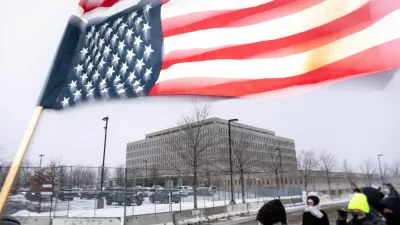  SENSITIVE MATERIAL. THIS IMAGE MAY OFFEND OR DISTURB  An inverted U.S. flag, stained with pepper spray, flutters in the wind in front of the Bishop Henry Whipple Federal Building, during a protest, more than a week after a U.S. Immigration and Customs Enforcement (ICE) agent fatally shot Renee Nicole Good on January 7, in Minneapolis, Minnesota, U.S., January 16, 2026. REUTERS/Tim Evans   TPX IMAGES OF THE DAY