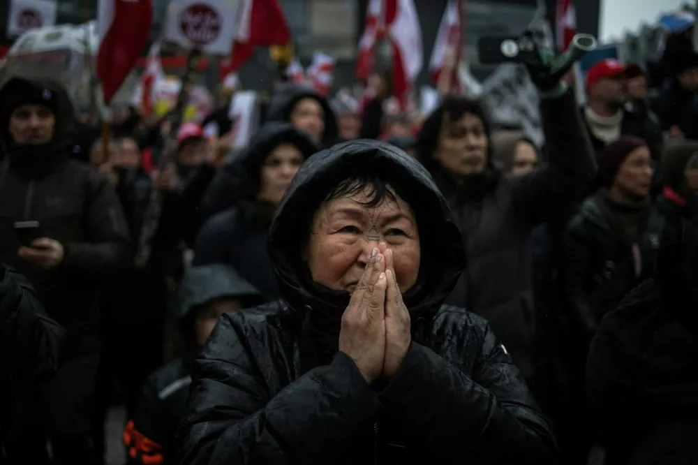 People attend a protest against U.S. President Donald Trump's demand that the Arctic island be ceded to the U.S., calling for it to be allowed to determine its own future, in Nuuk, Greenland, January 17, 2026. REUTERS/Marko Djurica