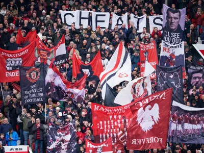 Manchester United fans cheer during the English Premier League soccer match between Manchester United and Manchester City in Manchester, England, Saturday, Jan. 17, 2026. (AP Photo/Dave Thompson)