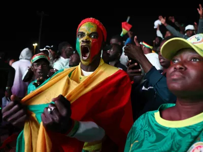 Soccer Football - CAF Africa Cup of Nations - Morocco 2025 - Final - Fans watch Senegal v Morocco - Dakar, Senegal - January 18, 2026 Senegal fans react as they watch the final match between Senegal and Morocco in Dakar REUTERS/Zohra Bensemra