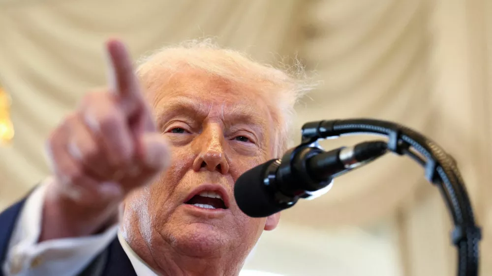 FILE PHOTO: U.S. President Donald Trump speaks at a ceremony held to dedicate a 4-mile stretch of road from West Palm Beach Airport to his Mar-a-Lago estate as 'President Donald J. Trump Boulevard', at the Mar-a-Lago estate in Palm Beach, Florida, U.S., January 16, 2026. REUTERS/Kevin Lamarque/File Photo