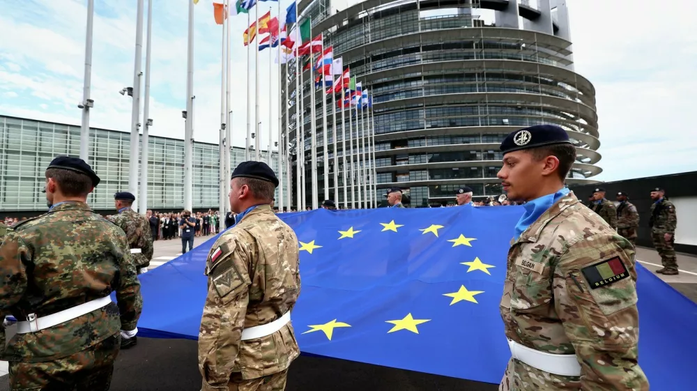 Eurocorps soldiers carry a European Union flag during the flag-raising ceremony on the eve of the inaugural session of new European Parliament in front of Louise Weiss building, headquarters of the European Parliament in Strasbourg, eastern France, on July 15, 2024.,Image: 889869139, License: Rights-managed, Restrictions:, Model Release: no