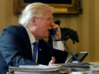U.S. President Donald Trump speaks by phone with Russia's President Vladimir Putin in the Oval Office at the White House in Washington, U.S. January 28, 2017. REUTERS/Jonathan Ernst