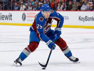 Jan 19, 2026; Denver, Colorado, USA; Colorado Avalanche center Nathan MacKinnon (29) controls the puck in the second period against the Washington Capitals at Ball Arena. Mandatory Credit: Isaiah J. Downing-Imagn Images