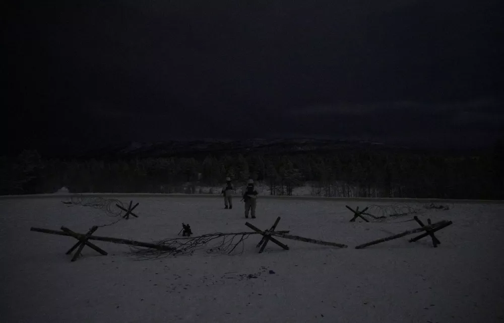 FILE PHOTO: Norwegian soldiers stand guard in front of a temporary command centre camp during "Reindeer 2", a Norwegian-U.S. military drill, in Setermoen, Norway, October 29, 2019. REUTERS/Stoyan Nenov/File Photo
