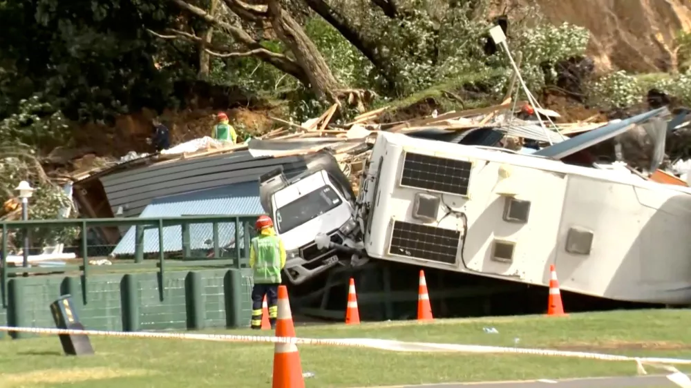Damaged caravans and vehicles remain stuck amid rubble, in the aftermath of a landslide at a campsite triggered by heavy rains, in Mount Maunganui, New Zealand January 22, 2026.  TVNZ via REUTERS TV/Handout via REUTERS  THIS IMAGE HAS BEEN SUPPLIED BY A THIRD PARTY. NEW ZEALAND OUT. NO COMMERCIAL OR EDITORIAL SALES IN NEW ZEALAND. AUSTRALIA OUT. NO COMMERCIAL OR EDITORIAL SALES IN AUSTRALIA. No use New Zealand internet sites/any internet site of any New Zealand or Australia based media organisations or mobile platforms   TPX IMAGES OF THE DAY