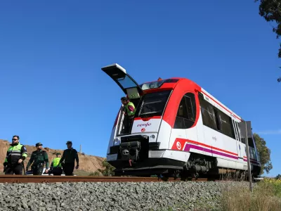 Members of the Spanish police force work at the site where a commuter train collided with a crane in the country's fourth rail crash in less than a week, with several people suffering minor injuries in the crash, near the port city of Cartagena in Murcia region,Spain, January 22, 2026. REUTERS/Loyola Perez de Villegas Muniz