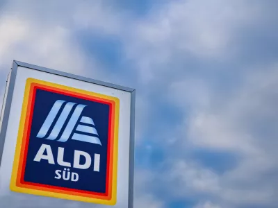 23 January 2026, Muelheim an der Ruhr: A company sign stands at the entrance to Aldi Sued's German headquarters in Muelheim an der Ruhr. Several hundred jobs will be lost at Aldi Sued's German headquarters over the next few years, the company confirmed. Photo: Christoph Reichwein/dpa