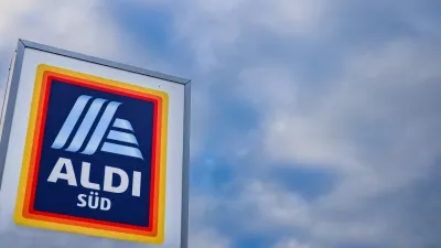 23 January 2026, Muelheim an der Ruhr: A company sign stands at the entrance to Aldi Sued's German headquarters in Muelheim an der Ruhr. Several hundred jobs will be lost at Aldi Sued's German headquarters over the next few years, the company confirmed. Photo: Christoph Reichwein/dpa