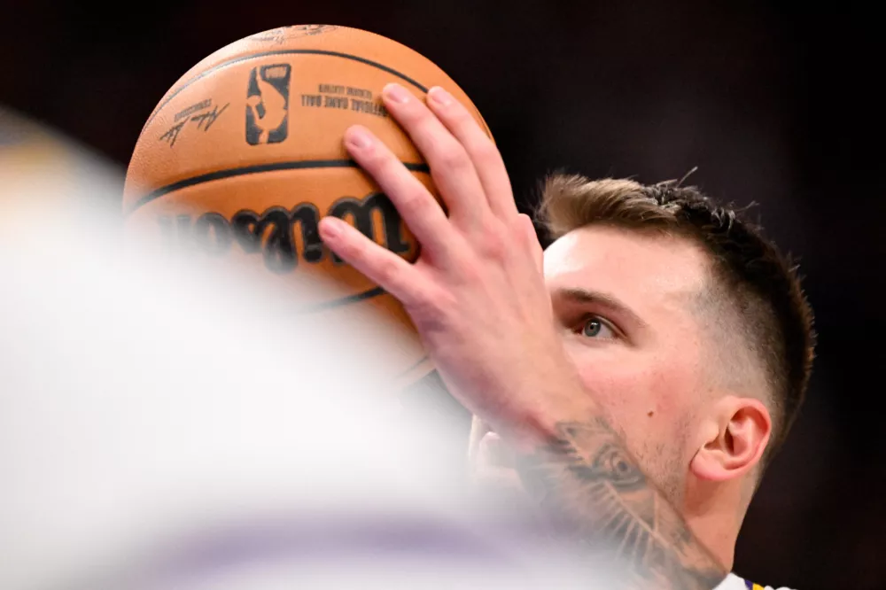 Jan 24, 2026; Dallas, Texas, USA; Los Angeles Lakers guard Luka Doncic (77) attempts a free throw during the second half against the Dallas Mavericks at the American Airlines Center. Mandatory Credit: Jerome Miron-Imagn Images