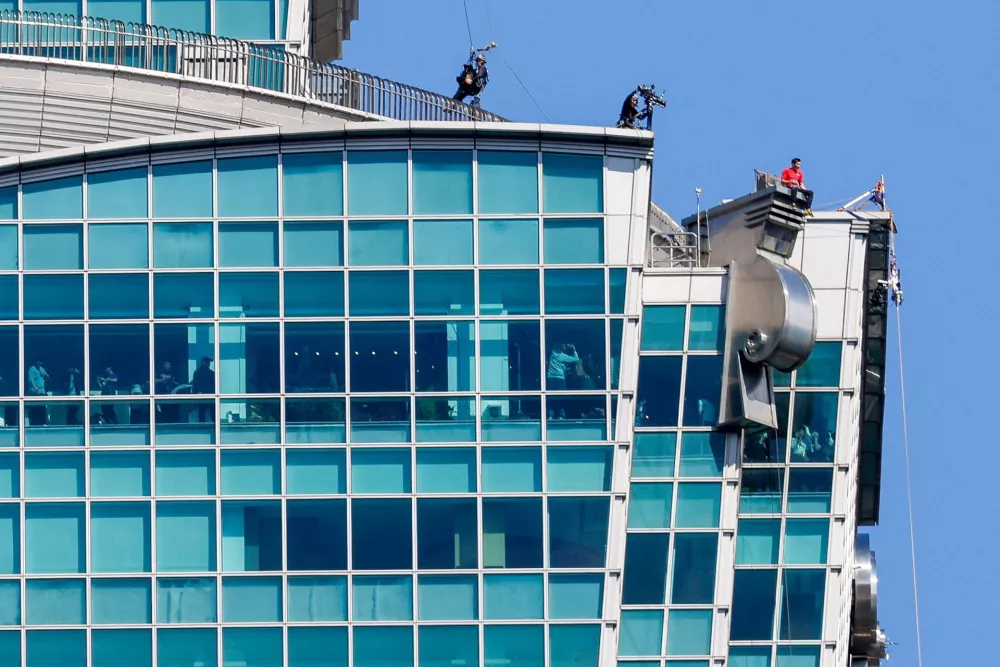 Climber Alex Honnold takes a break while free soloing Taipei 101 Skyscraper in Taipei, Taiwan, January 25, 2026 REUTERS/Ann Wang