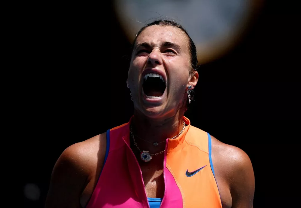 Tennis - Australian Open - Melbourne Park, Melbourne, Australia - January 25, 2026 Belarus' Aryna Sabalenka reacts during her fourth round match against Canada's Victoria Mboko REUTERS/Edgar Su   TPX IMAGES OF THE DAY