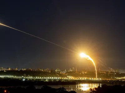 Ukrainian air defense intercepts a Shahed drone mid-air in the third Russia aerial attack on the capital in the last 24 hours in Kyiv, Ukraine, Tuesday, May 30, 2023. (AP Photo/Evgeniy Maloletka)