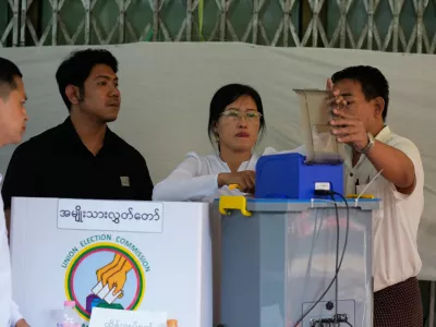 Officials of the Union Election Commission prepare to count ballots at a polling station, during the final round of general election Sunday, Jan. 25, 2026, in Yangon, Myanmar. (AP Photo/Thein Zaw)