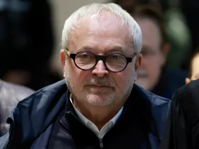 FILE PHOTO: Former French Senator Joel Guerriau arrives with his lawyer Henri Carpentier for a hearing in his trial for allegedly spiking member of parliament Sandrine Josso's drink with the intention of sexually assaulting her, at the courthouse in Paris, France, January 26, 2026. REUTERS/Stephanie Lecocq/File Photo