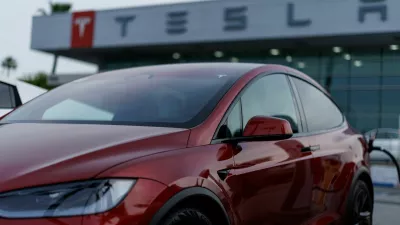 A Tesla model Y is shown charging at a Tesla dealership in Buena Park, California, U.S., January 28, 2026. REUTERS/Mike Blake