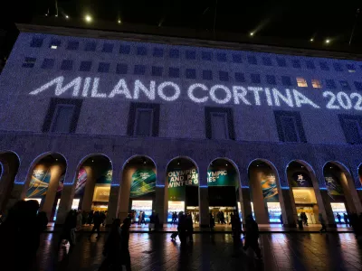 Olympic rings are projected on the facade of a building in front of the Duomo gothic cathedral, in Milan, Italy, Wednesday, Jan. 28, 2026. (AP Photo/Luca Bruno)