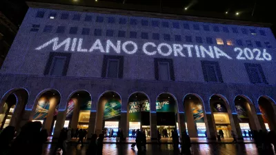 Olympic rings are projected on the facade of a building in front of the Duomo gothic cathedral, in Milan, Italy, Wednesday, Jan. 28, 2026. (AP Photo/Luca Bruno)