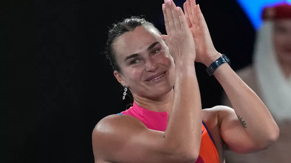 Aryna Sabalenka of Belarus celebrates after defeating Elina Svitolina of Ukraine in their semifinal match at the Australian Open tennis championship in Melbourne, Australia, Thursday, Jan. 29, 2026. (AP Photo/Aaron Favila)
