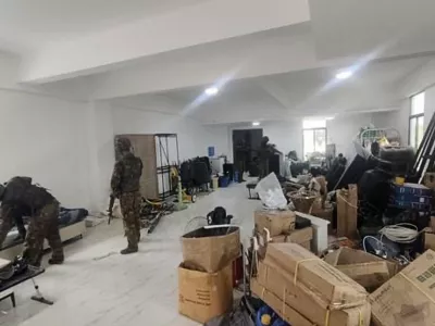 In this image provided by the Myanmar military on Oct. 19, 2025, soldiers raid the KK Park online scam center in Myawaddy township, Karen State, Myanmar. (The Myanmar Military True News Information Team via AP)