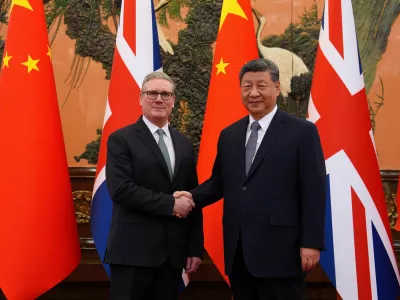Britain's Prime Minister Keir Starmer shakes hands with Chinese President Xi Jinping ahead of a bilateral meeting during his visit to China, in Beijing, China, January 29, 2026.Carl Court/Pool via REUTERS   TPX IMAGES OF THE DAY