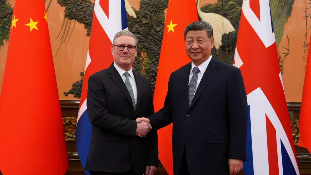 Britain's Prime Minister Keir Starmer shakes hands with Chinese President Xi Jinping ahead of a bilateral meeting during his visit to China, in Beijing, China, January 29, 2026.Carl Court/Pool via REUTERS   TPX IMAGES OF THE DAY
