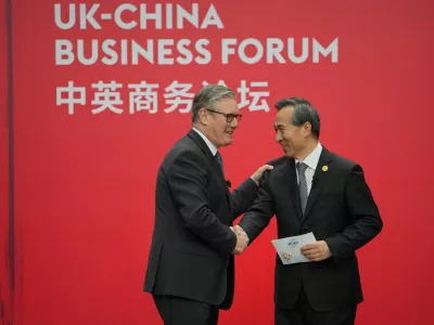 Britain's Prime Minister Keir Starmer shakes hands with Ren Hongbin, Chairman of the China Council for the Promotion of International Trade (CCPIT) during the UK-China Business Forum in Beijing, China, January 30, 2026. Carl Court/Pool via REUTERS