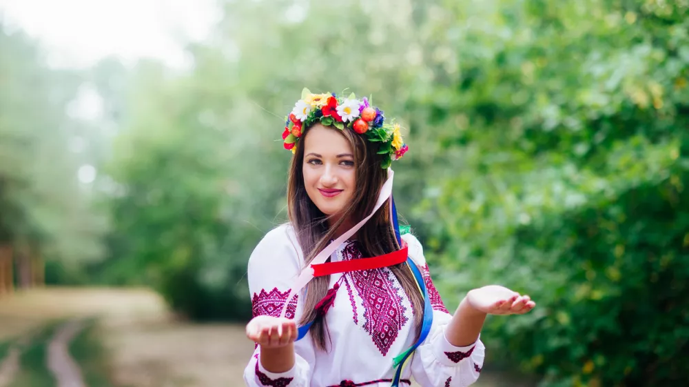 Portrait of a girl in nationac ukrainian clothes in the park