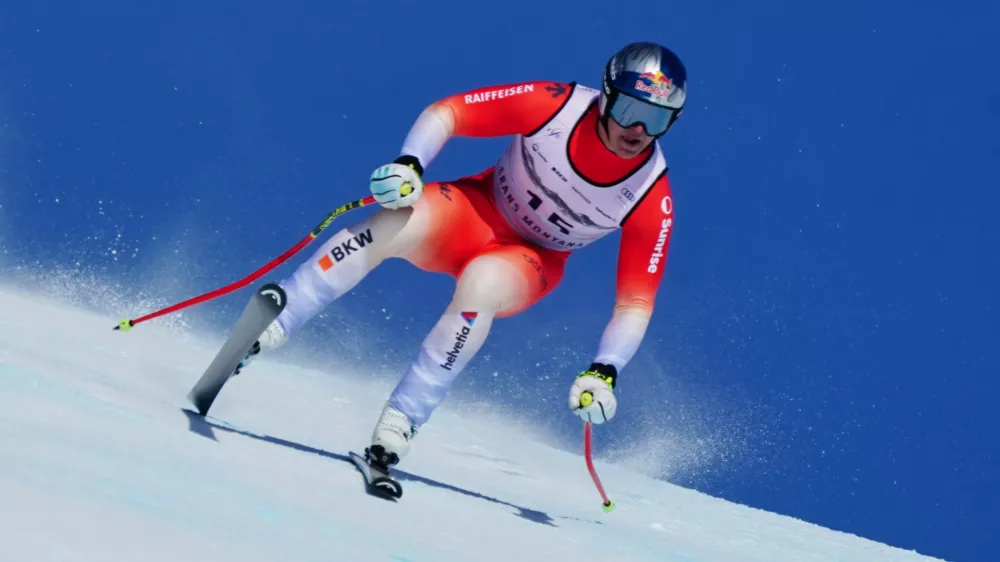 Switzerland's Franjo von Allmen speeds down the course during an alpine ski, men's World Cup downhill, in Crans Montana, Switzerland, Sunday, Feb. 1, 2026. (AP Photo/Pier Marco Tacca)