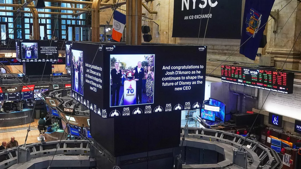 Video screens above trading posts the floor of the New York Stock Exchange display a congratulatory message to Disney parks chief Josh D'Amaro named as its next CEO, succeeding Bob Iger, Tuesday, Feb. 3, 2026. (AP Photo/Richard Drew)