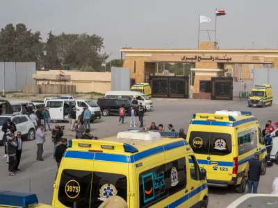 Ambulances line up to enter the Egyptian gate of the Rafah crossing into the Gaza Strip, in Rafah, Egypt, Monday, Feb. 2, 2026. (AP Photo/Mohamed Arafat)