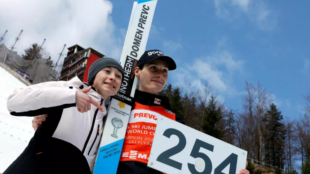 FILE PHOTO: Ski Jumping - FIS Ski Jumping World Cup - Planica, Slovenia - March 30, 2025 Slovenia's Domen Prevc poses with his sister Nika Prevc after setting a new world record in the Men's Individual HS240 Second Round REUTERS/Borut Zivulovic/File Photo