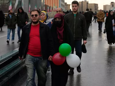 People attend a state-organised rally in Tehran, Iran, Wednesday, Feb. 4, 2026, celebrating the birthday of Imam Mahdi, or "Hidden Imam," a 9th-century saint whom Shiite Muslims believe will return at the end of time as a universal reformer to end tyranny and promote justice. (AP Photo/Vahid Salemi)